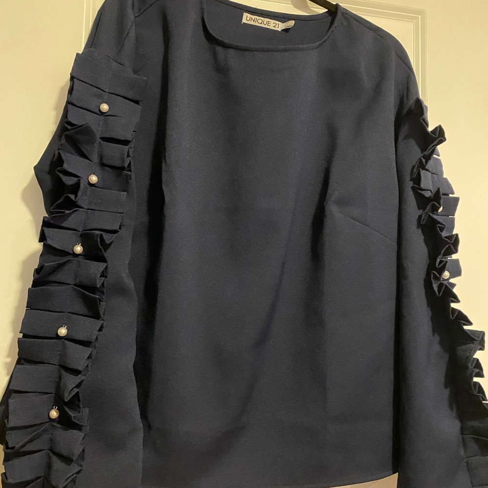 Navy shirt with pearl details on sleeve